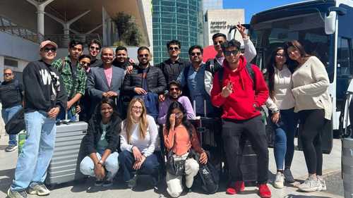 A photograph of postgraduate students on field trip at Lisbon airport