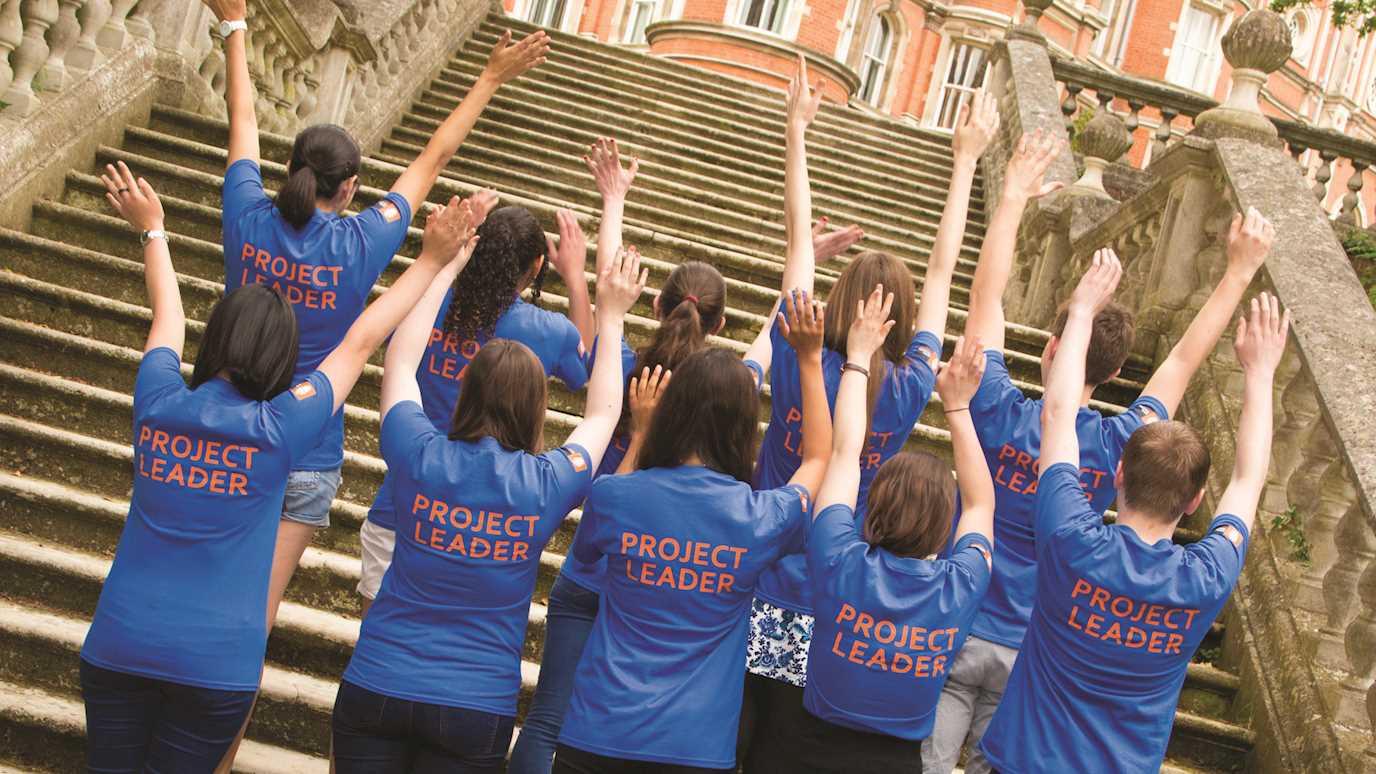 volunteers standing on founders steps - volunteering